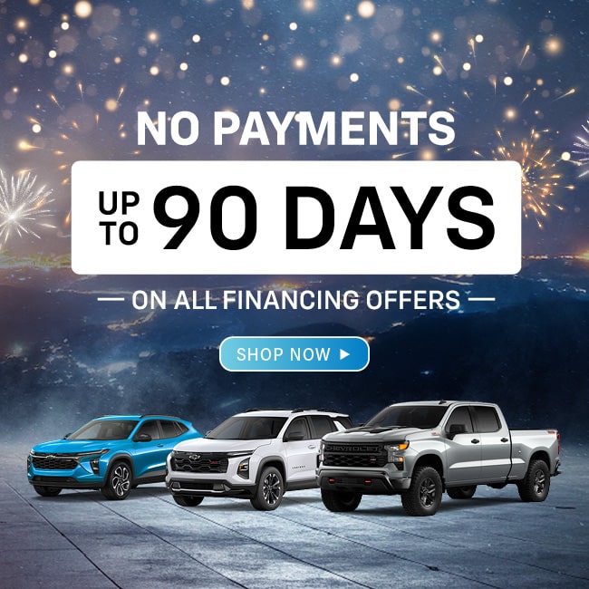 No payments for 90 days offer on vehicle financing. Three cars showcased with fireworks background.