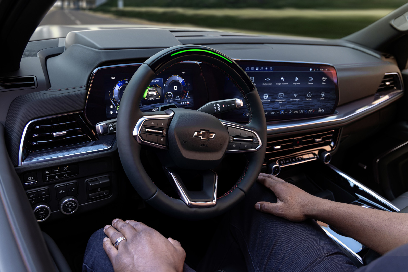 Modern Chevrolet car interior showing steering wheel, digital dashboard, and touchscreen controls.